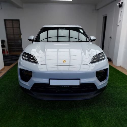 White Porsche in a detailing workshop