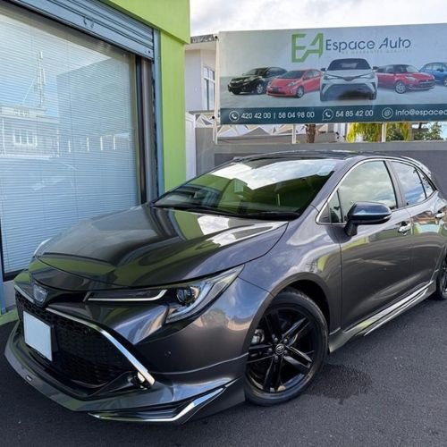 Black Toyota Corolla Sport on at car dealership parking