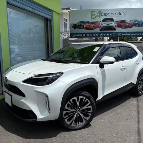 White Toyota Yaris Cross at car dealership parking