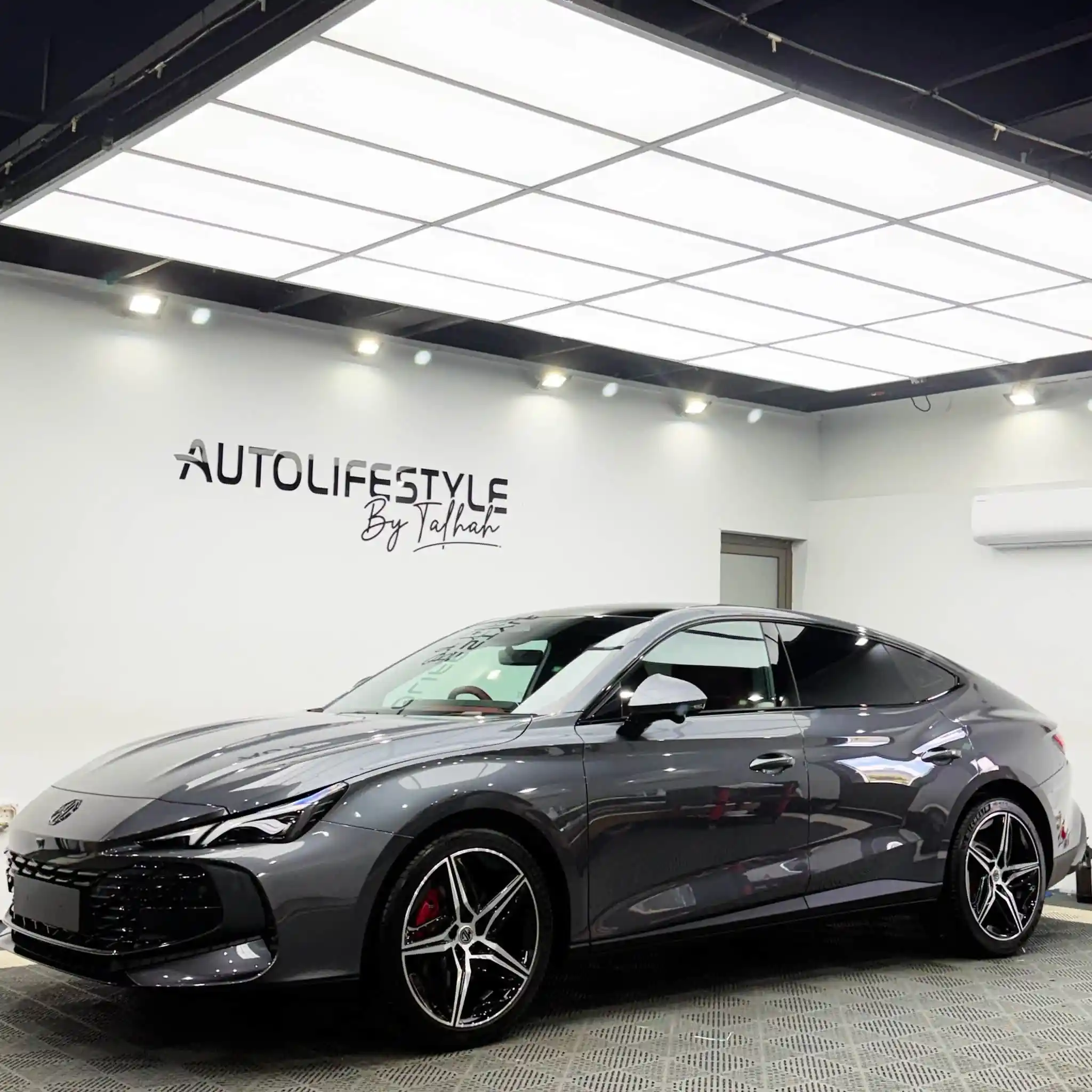 Grey MG car at detailing workshop post graphene application