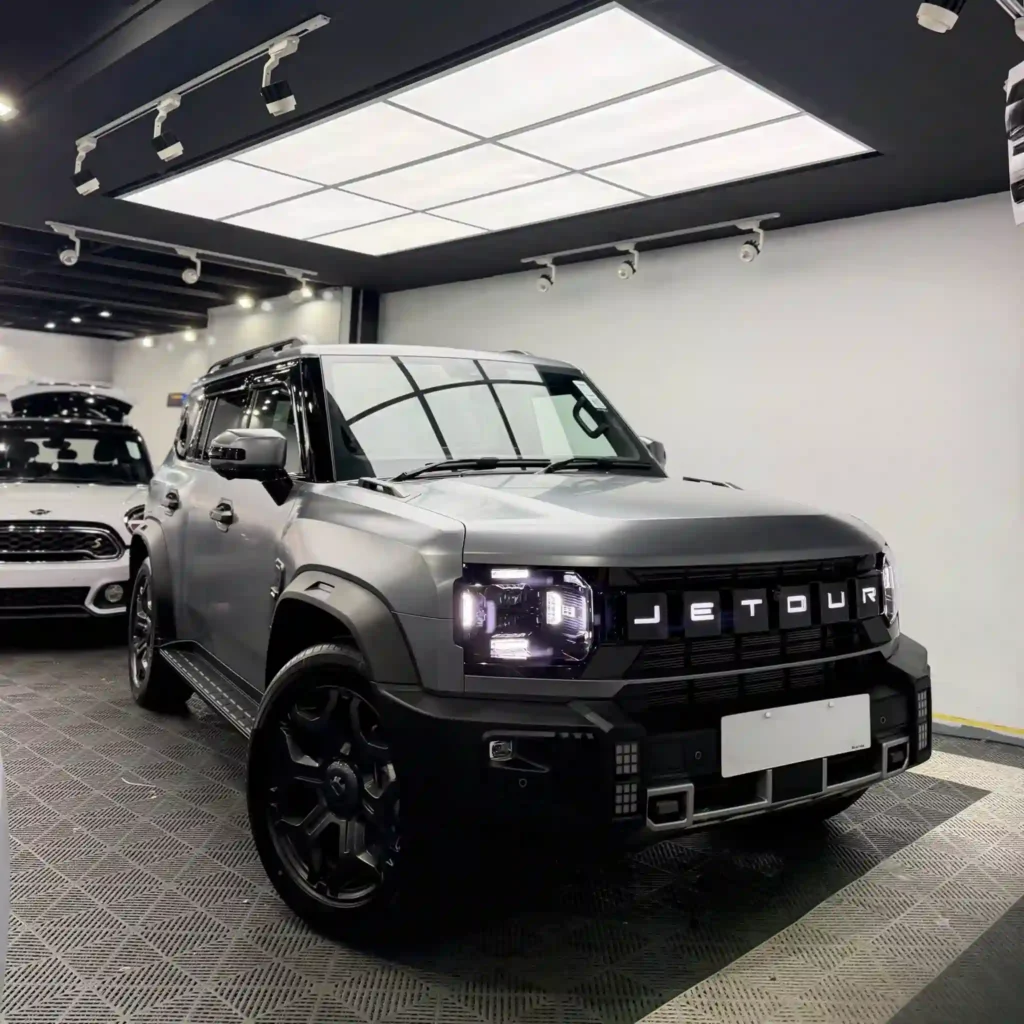 Grey Jetour SUV in detailing workshop