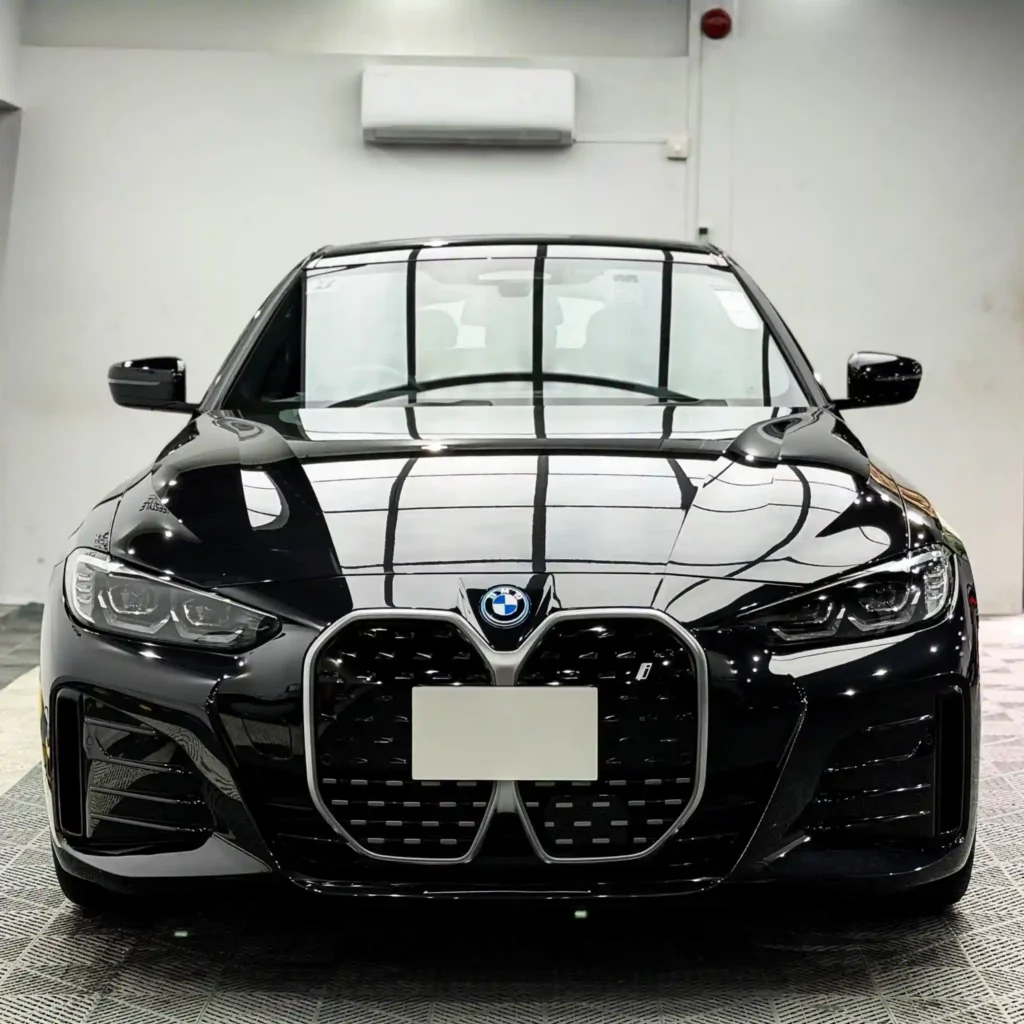 Black BMW 3 Series in a detailing workshop