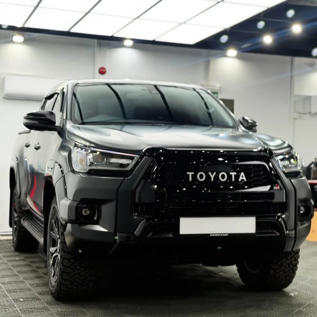 Black Toyota Hilux in a detailing workshop