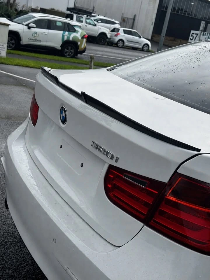 Black samurai spoiler on white BMW 320i