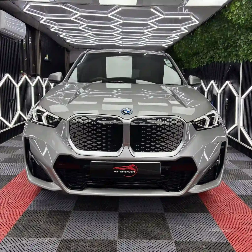 Grey BMW in a detailing workshop