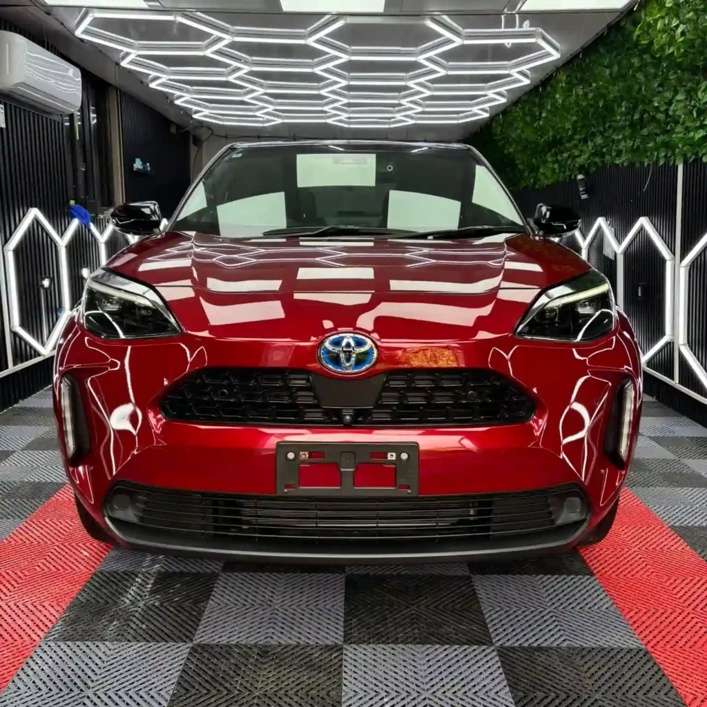 Red Toyota Yaris in a detailing workshop