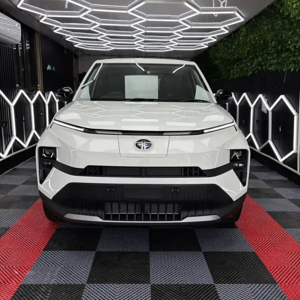 White Tata car in a detailing workshop