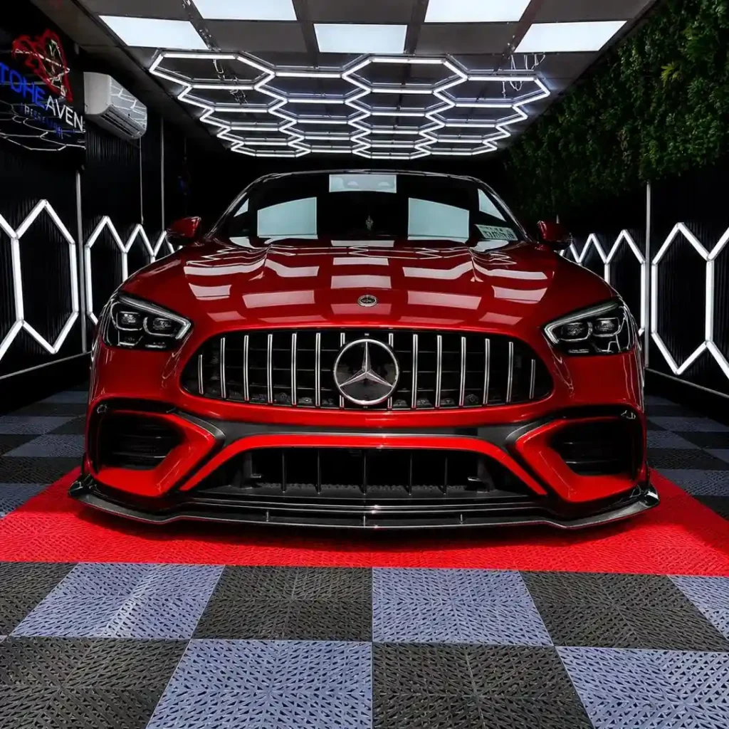 Red Mercedes Benz in a detailing workshop
