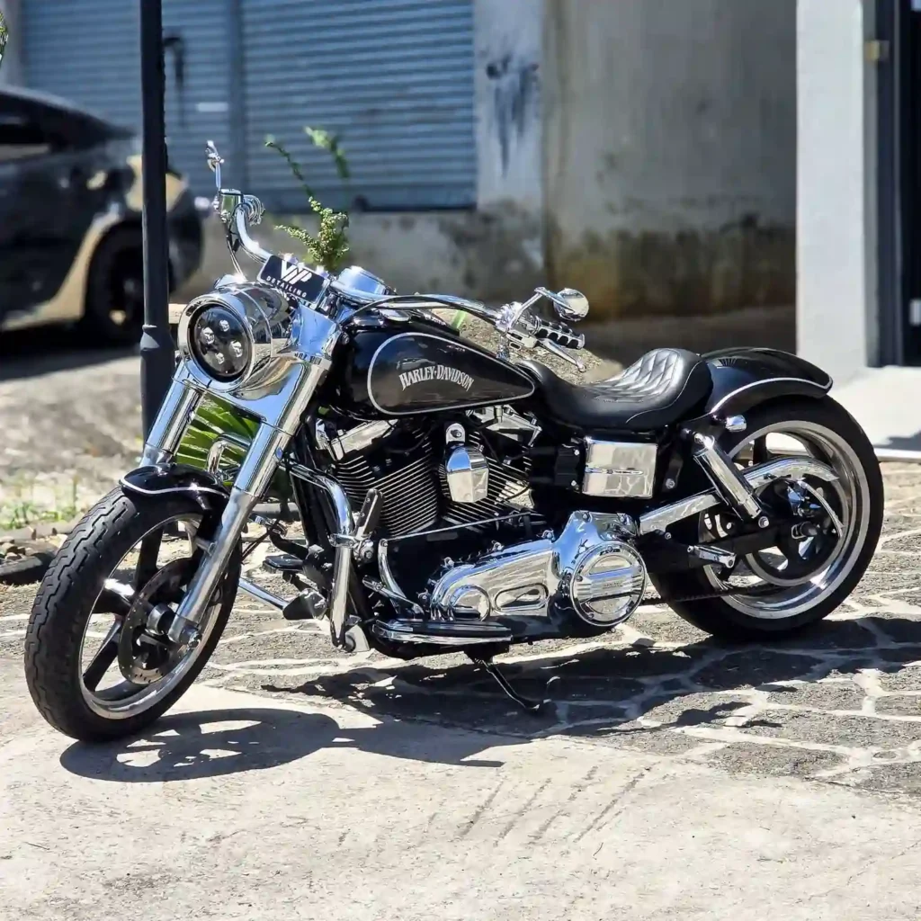 Black Harley Davidson Cruiser on a stoned parking