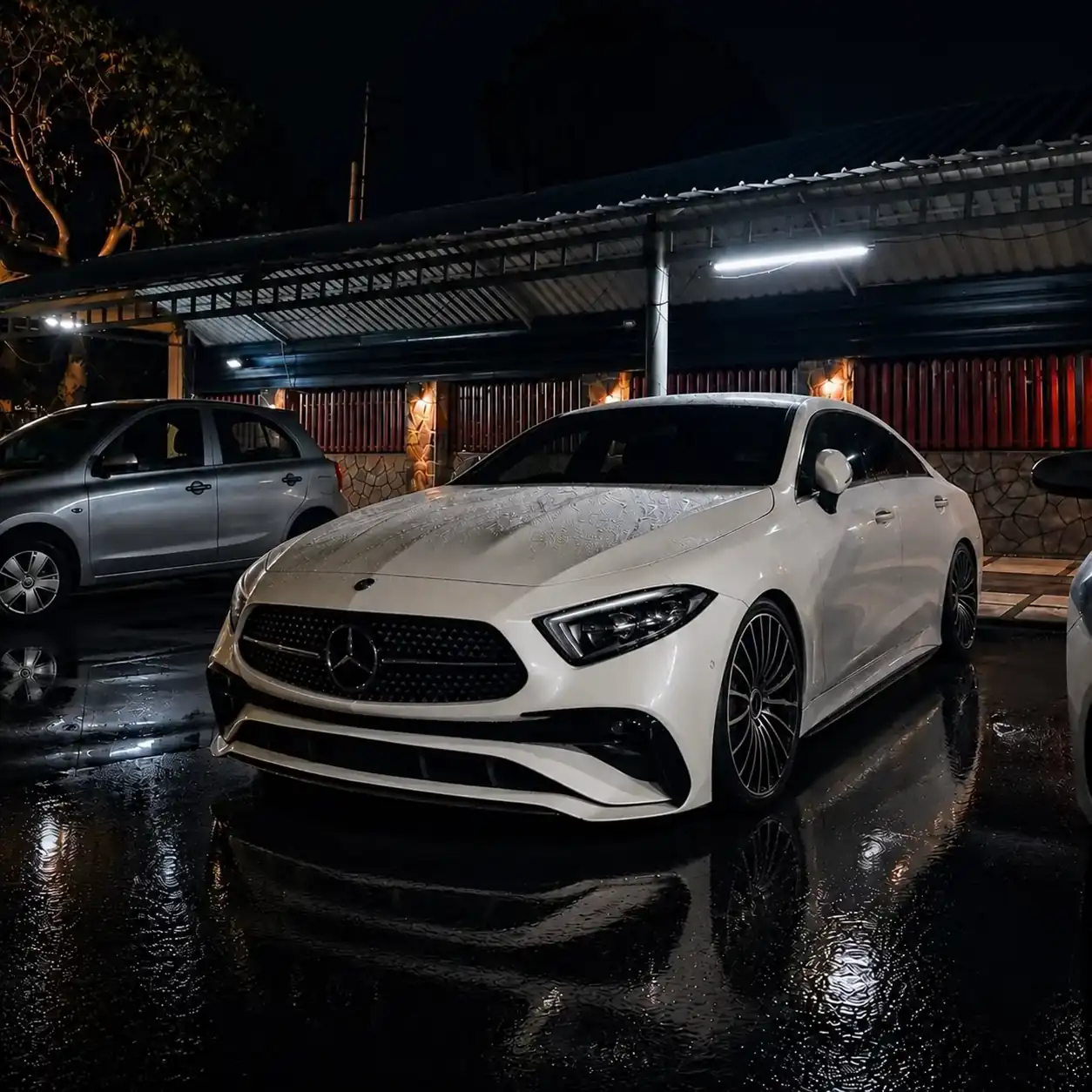 White Mercedes Benz on a parking lot