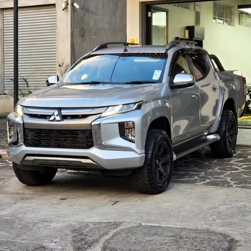 Grey Mitsubishi Triton on a car detailing parking